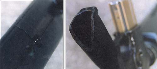 На цевье и рукоятке М-16А1 видны
                повреждения (трещина и скол), полученные